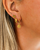 Gouden earparty met bloemen