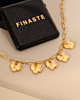 Gouden bedelketting met bloem bedels