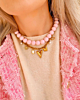 Necklaceparty met roze kralen en gouden bedels