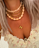 Gouden necklaceparty met kralen