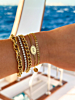 Gouden armparty met steentjes