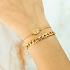 Gouden armbandjes in combinatie met schakelarmbandje