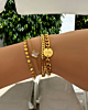 Gouden armbanden mix om pols