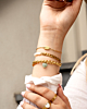 Gouden armbanden mix