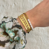 Mooie gouden smalle bangle voor bij een armparty