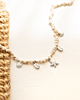 zilveren bedelketting met witte steentjes