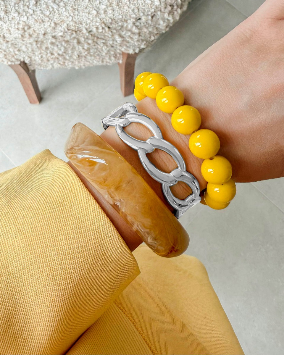 Zilveren bangle armparty met gele details