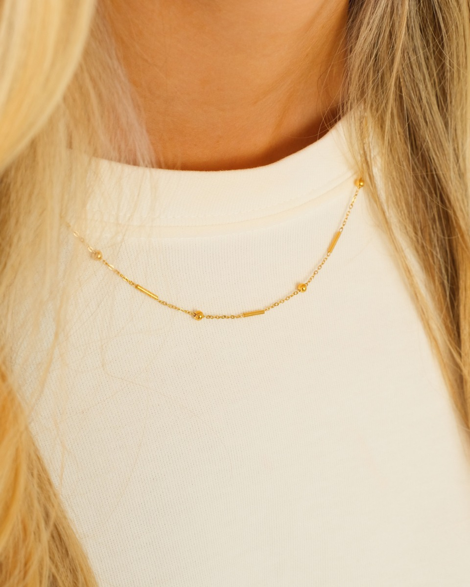 Ketting met subtiele bolletjes & tubes goud